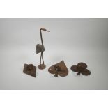 Three iron pricket sconces in the form of card suits, together with an iron and wood figure of a