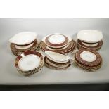 A vintage J&G Meakin red and gilt 'Sol' pattern dinner service with four oval platters, lidded