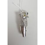 A novelty sterling silver pendant whistle in the form of an owl's head, 1½" long
