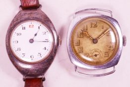 A vintage silver cased wristwatch together with another vintage watch