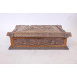 A late C18th/early C19th Black Forest carved oak bible box, 20" x 15" x 6"
