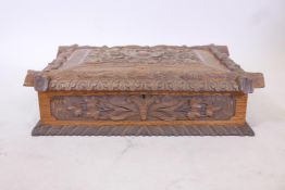 A late C18th/early C19th Black Forest carved oak bible box, 20" x 15" x 6"