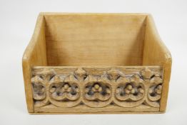 An Edwardian hand carved gothic style church letter rack/collection box in old pine, stamped to