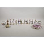 Ten continental hard paste porcelain figures depicting the months of the year, crossed sword mark to