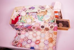 A box of vintage quilting materials