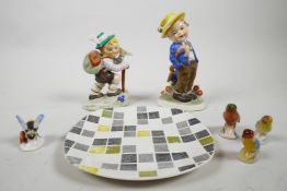 Two 1950s Goebel Hummel style figures, one of a German boy mountaineering, and another of a boy in