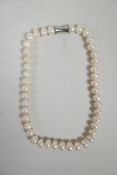 A chunky white pearl necklace, 16" long