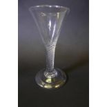 A Georgian clear airtwist stem wine glass with fluted bowl and rolled foot, 5" high