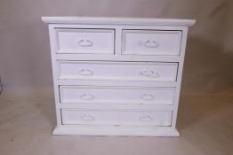 A painted hardwood chest of two over three drawers, with moulded front and metal drop handles, 39" x