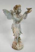 A cast metal garden figure of a fairy holding a bird, 20" high