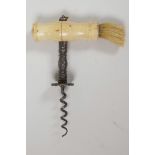 An antique double helix steel corkscrew with bone handle and hair brush, 6" long