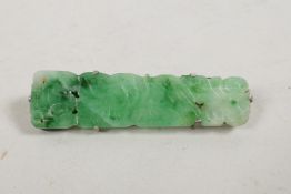 A Chinese white metal brooch set with jade, early C20th, 2" long