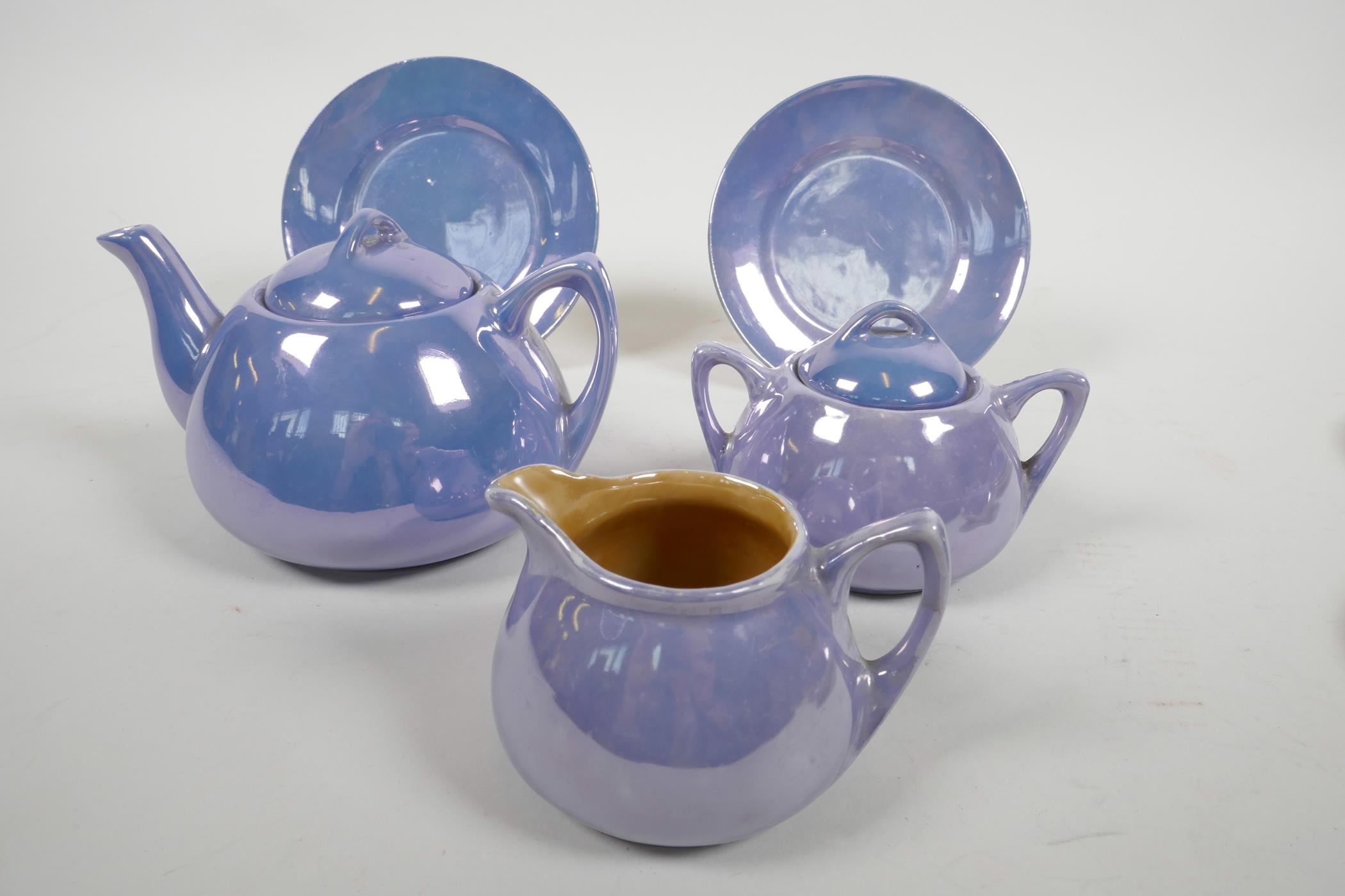 A mid C20th Staffordshire lustreware child's miniature tea service, comprising a teapot, sugar bowl, - Image 2 of 4