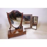 A C19th mahogany shield shaped bow fronted swing toilet mirror with three drawers, 24" high, and a