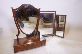 A C19th mahogany shield shaped bow fronted swing toilet mirror with three drawers, 24" high, and a