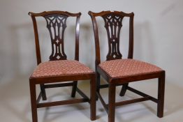 A pair of C18th/C19th mahogany Chippendale side chairs, with pierced Gothic splats, raised on square