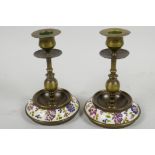 A pair of brass candlesticks with inset Zsolnay style porcelain bases, 6" high