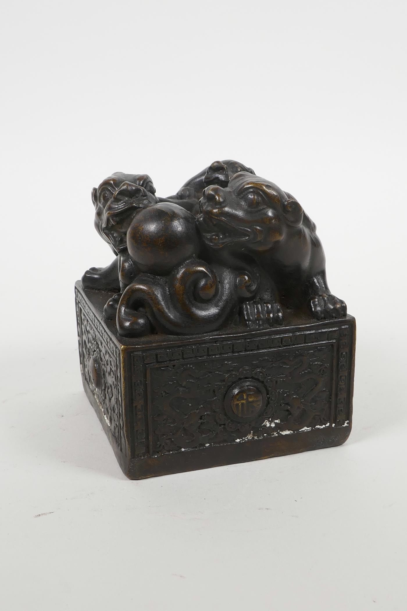 A Chinese filled bronzed metal square form seal, with kylin decoration, 3" x 3" x 4" high - Image 2 of 3