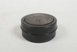 A German reproduction wood and metal snuff box, 2½" diameter