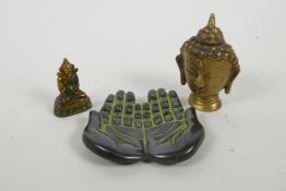 A Tibetan brass Buddha head, together with a small brass Buddha and a bronze trinket tray in the