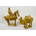 Two Chinese treacle glazed pottery figurines of a mounted warlord and a camel, 8½" high
