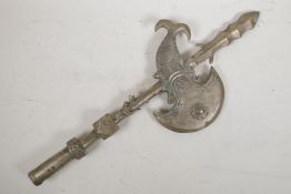 A Sino-Tibetan filled silvered metal ceremonial axe with stylised dragon head decoration, 21½" long