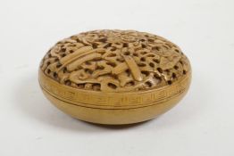 A Chinese carved boxwood box, the cover decorated with the emblems of the eight immortals, 3"