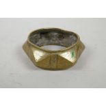 An African brass faceted cash bangle, 4" diameter