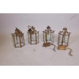 A set of four brass and glass hall lanterns, 11½", A/F