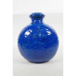 A Chinese blue glazed pottery vase with underglaze dragon decoration, character marks to base, 9½"