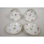 Four Meissen butter pat dishes dated 1815, hand painted in the scatter flower pattern with gold