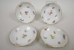 Four Meissen butter pat dishes dated 1815, hand painted in the scatter flower pattern with gold