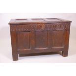 A C17th/18th oak triple panel coffer with carved frieze and moulded detail, 36" x 23" x 19"