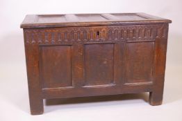 A C17th/18th oak triple panel coffer with carved frieze and moulded detail, 36" x 23" x 19"