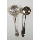 A Swedish silver tea strainer marked L.E.T, Stockholm, 1840, and another marked 'L.L.S', 8" long,