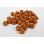 A quantity of loose amber style beads