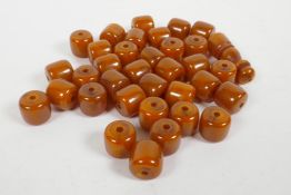 A quantity of loose amber style beads