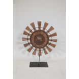 A teak and wrought metal wheel sculpture, 21½" diameter