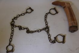 A set of C19th bronze and iron manacles (lacks key), and an antique boot last