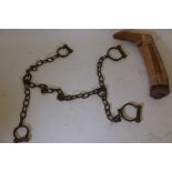 A set of C19th bronze and iron manacles (lacks key), and an antique boot last