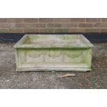 A reconstituted stone garden trough with floral spray decoration, 20½" x 26"