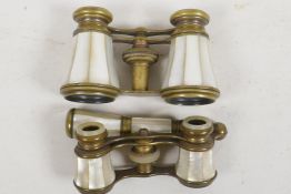 Two pairs of mother of pearl and brass opera glasses, largest 4" wide