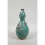 A Chinese green dapple glazed pottery double gourd vase with applied frog decoration, 9½" high