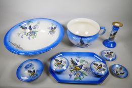 A late 1940s Staffordshire Falcon ware toiletry and dressing table set, decorated with enamel