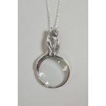 A 925 silver magnifying glass pendant necklace in the form of a cat, 2½" drop