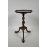 A Victorian mahogany wine table on a turned column and tripod supports, with a pie-crust top, A/F