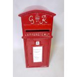 A cast iron and metal postbox with key, 23" x 14½" x 11"