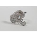 A 925 silver ring with elephant head decoration set with cubic zirconia and opal eyes, approximate