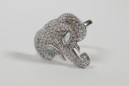 A 925 silver ring with elephant head decoration set with cubic zirconia and opal eyes, approximate