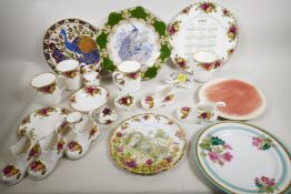 A quantity of decorative porcelain including Royal Albert Old Country Rose mugs and calendar